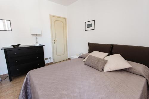 a bedroom with a bed with two pillows on it at Italianflat - Palazzo Zeiner in Verona