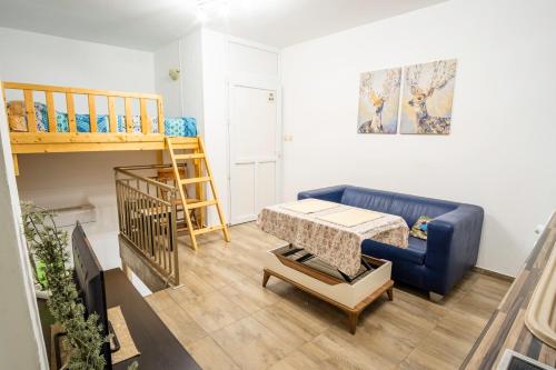 a living room with a couch and a bunk bed at Ruse Apartment Center in Ruse