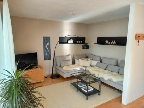 a living room with a couch and a table at Wohnung im Herzen der Altstadt in Schwaz