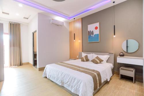 Ένα ή περισσότερα κρεβάτια σε δωμάτιο στο Every Day Guest House - Phan Thiet
