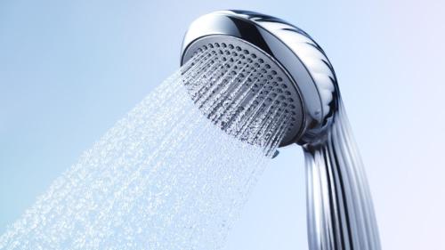 a shower head with water coming out of it at Dormy Inn Express Toyohashi in Toyohashi