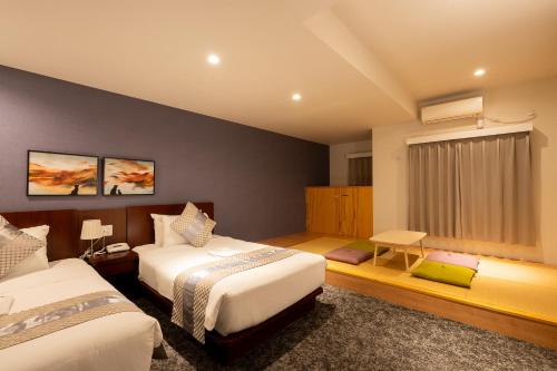 Lova arba lovos apgyvendinimo įstaigoje Hotel Tokyo Trip Ueno Nishi Nippori