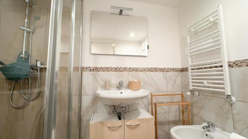 a bathroom with a sink and a shower at Maison Studio 2 by Ca-Sa Check in Chioggia
