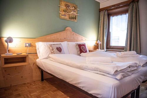 Posteľ alebo postele v izbe v ubytovaní Appartamento Mokino Center Myholidaylivigno