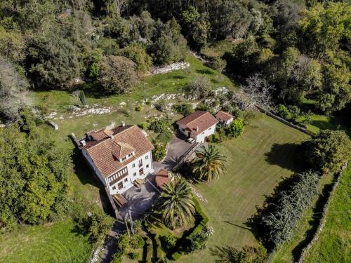 an aerial view of a house in a field at Casas El Jogueru in Ribadesella