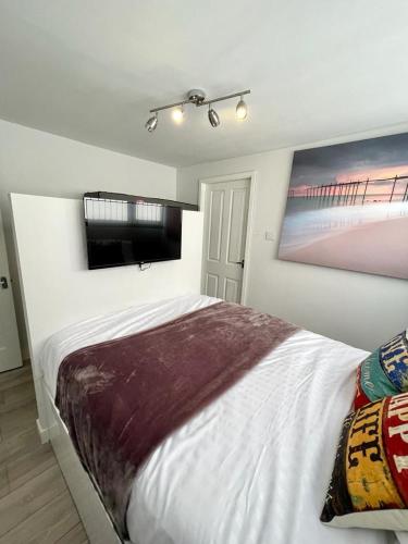 Ένα ή περισσότερα κρεβάτια σε δωμάτιο στο Blakes Beach House Humberston Fitties