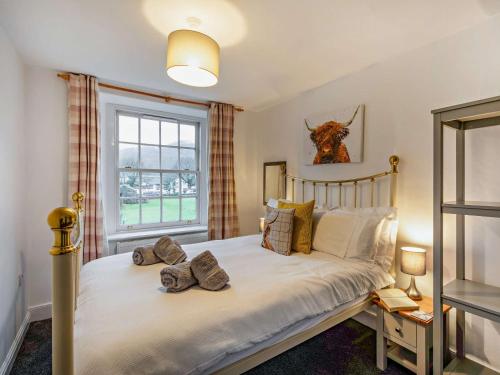 a bedroom with a bed and a window at 1 Bed in Keswick 86246 in Rosthwaite