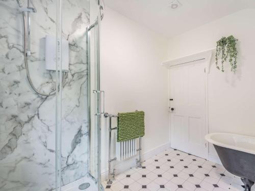 a bathroom with a shower and a sink at 3 bed in Corwen 86266 in Corwen