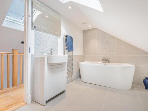 a bathroom with a white tub and a sink at 2 Bed in Alston SZ186 in Leadgate