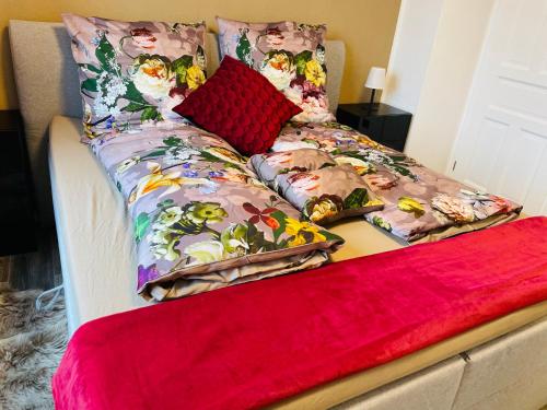a bed with two pillows on top of it at Pension Michelangelo Stadtmitte "Netflix" in Eisenach