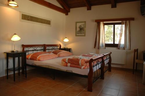 a bedroom with two beds and a window at Penzion "U Kubínů" in Přibyslav