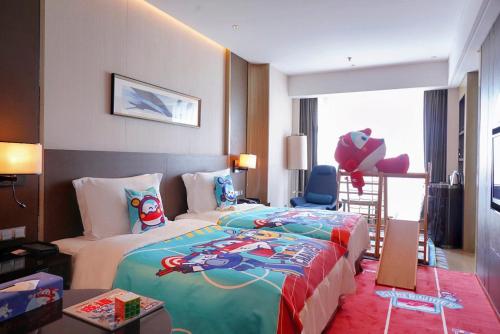 Postel nebo postele na pokoji v ubytování Crowne Plaza Dalian Sports Center by IHG
