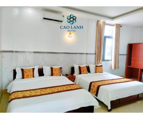 Postel nebo postele na pokoji v ubytování Cao Lanh Hotel