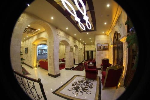 a view of a living room with chairs and a lobby at Tuğhan Hotel in Mardin
