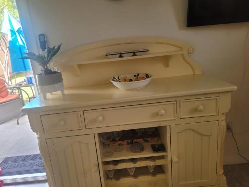 a wooden dresser with a bowl on top of it at ~ Cozy In-law Apartment Close to Siesta Key ~ in Sarasota