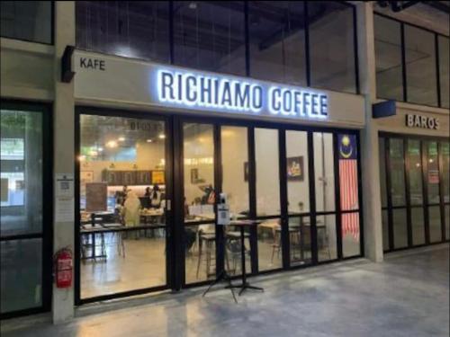 a ritzamine coffee store in a building at Tamarind suite 2Q beds Cyberjaya in Cyberjaya