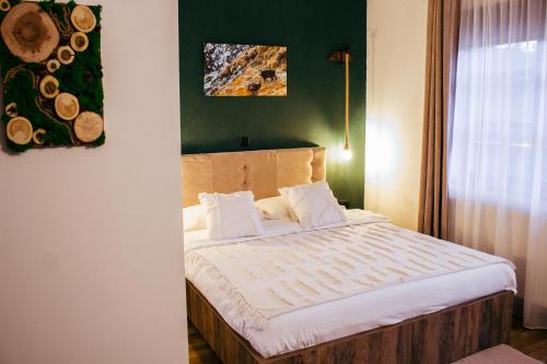 Säng eller sängar i ett rum på Casa Traian