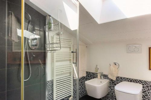 a bathroom with a shower and a toilet and a sink at Appartement Yoga - Vues Chaîne du Mont-Blanc - Calme - Espace Yoga Spacieux in Les Trabets