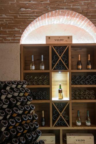 a wall of wine bottles in a wine cellar at Casa Valdo Country House in Valdobbiadene