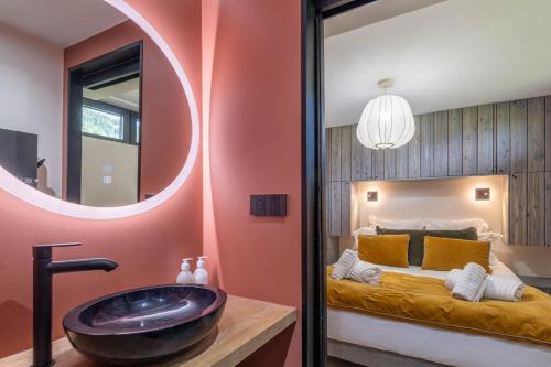 a bathroom with a large tub in a bedroom at SmartStay - Chalet Felix aux Confins in La Clusaz