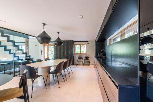 a kitchen and dining room with a table and chairs at SmartStay - Chalet Felix aux Confins in La Clusaz