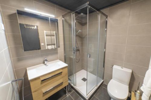 a bathroom with a shower and a toilet and a sink at DIFY Grand Soleil - Courchevel 1650 in Courchevel