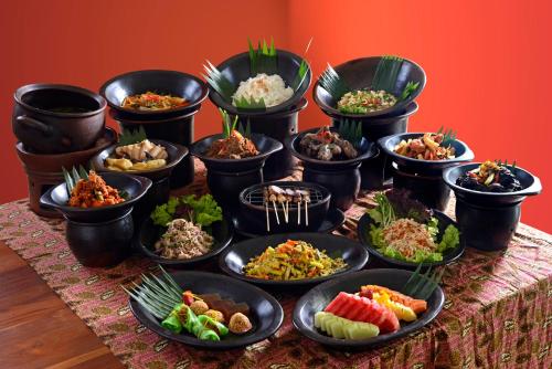 a group of bowls of food on a table at Rumah Luwih Bali in Keramas