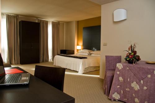 Postel nebo postele na pokoji v ubytování Hotel Fortyfive