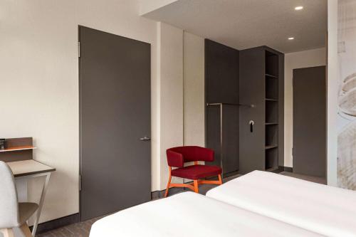 Postel nebo postele na pokoji v ubytování Vienna House Easy by Wyndham Coburg
