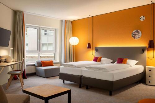 Postel nebo postele na pokoji v ubytování Vienna House Easy by Wyndham Coburg