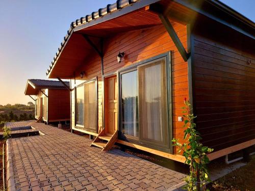 a house with windows on the side of it at Chirali Eco Villa in Kemer