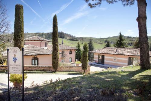 a house with a sign in front of it at Villa Castelletto in Castelletto Molina