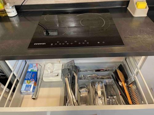a drawer in a kitchen with utensils at 4-bedroom Villa with pool and barbacue in Elche