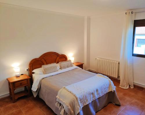 Postel nebo postele na pokoji v ubytování Hostal Mirall Rural