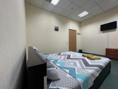 a bedroom with a bed in a room at Міні-готель "Старовокзальний" in Kyiv