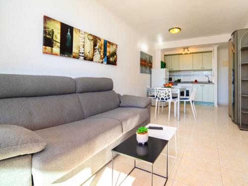 a living room with a couch and a kitchen at Apartment Zafiro 02 by Interhome in Calpe