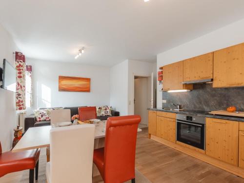 a kitchen and dining room with a table and chairs at Apartment Stefanie Top 6 by Interhome in Bad Hofgastein