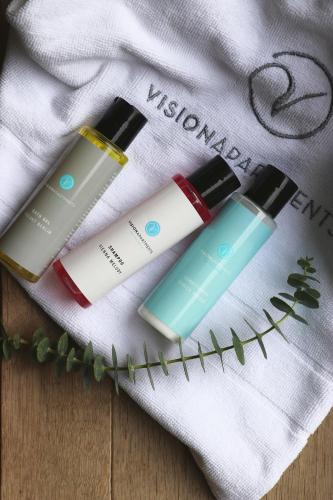 a group of three cosmetics sitting on top of a towel at VISIONAPARTMENTS Glattbrugg - contactless check-in in Glattbrugg