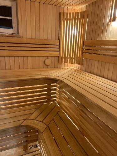 a room with wooden benches in a sauna at Holiday house near the city in Būdviečiai