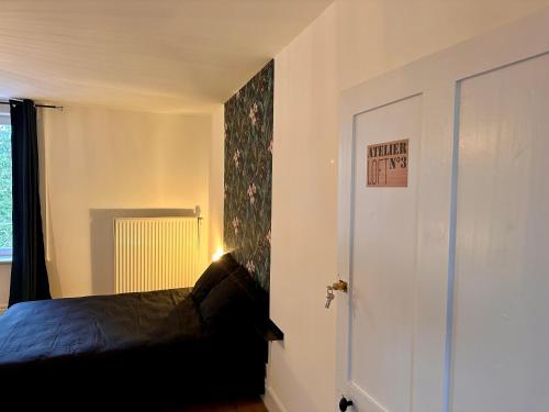 Postel nebo postele na pokoji v ubytování L'Atelier loft