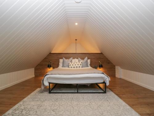 a bedroom with a bed in a attic at The Annex in Pershore