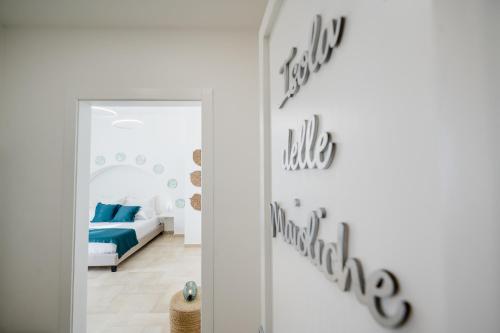 a bedroom with a bed and a mirror at Aurelia Sea View in Torre Canne