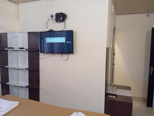 a camera is on the wall of a room at Hotel Western Park in Port Blair