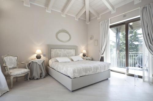 Кровать или кровати в номере Villa Castelletto