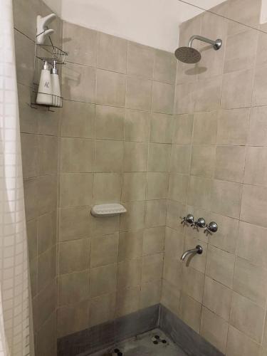 a bathroom with a shower with a sink at Complejo Sol - Departamento 4 in Concordia