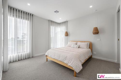 Ένα ή περισσότερα κρεβάτια σε δωμάτιο στο Indented Heads Beach House