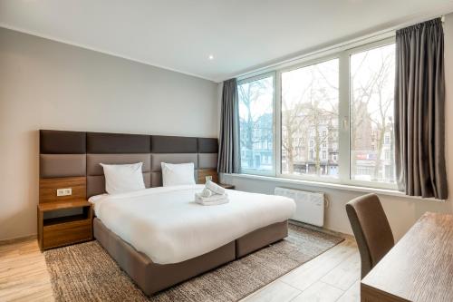 Кровать или кровати в номере Smartflats - Midi 33