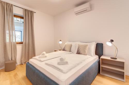 Krevet ili kreveti u jedinici u okviru objekta Mare Sano Plaza Resort - Apt Riva