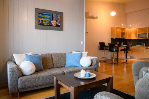 a living room with a couch and a table at Hamn i Senja in Hamn