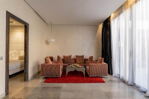 a living room with a couch and a table at Cesar Resort & Spa in Marrakech